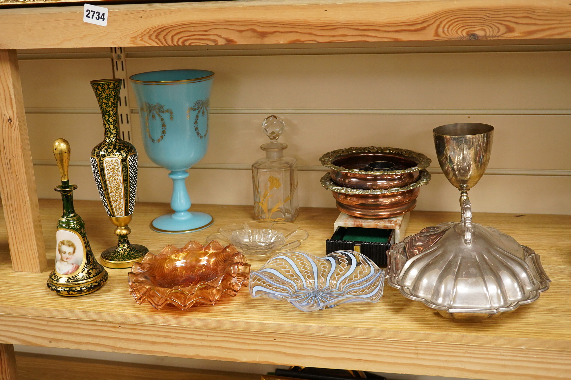 A Victorian gilt and enamelled green glass decanter, a similar vase, a small square decanter, Venetian dishes, silver plated coasters, etc